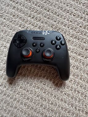 SteelSeries Black Wireless Gaming Controller with Orange Accents